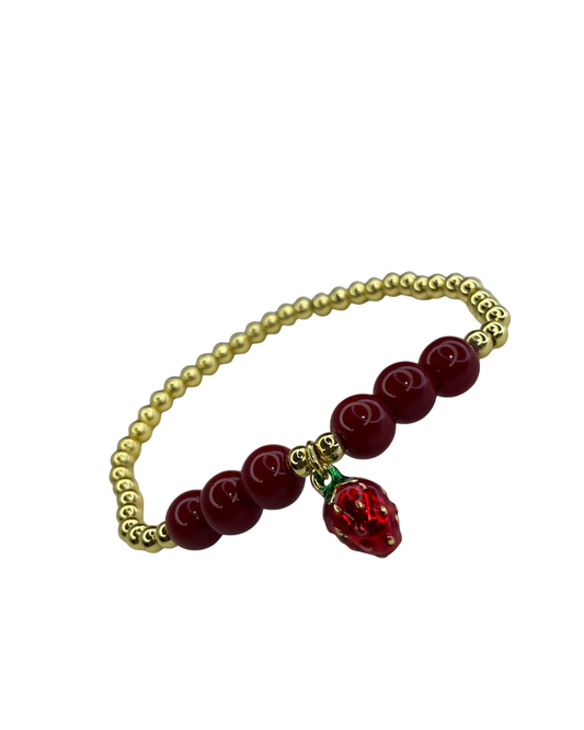 PULSERA DORADA Y ROJA CON DIJE DE FRESA